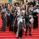 Co-authors of the book Noire N’est Pas Mon Metier (Black Is Not My Job) pose on the stairs of the Palais des Festivals convention center during the Cannes Film Festival on May 16, 2018, in Cannes, France.